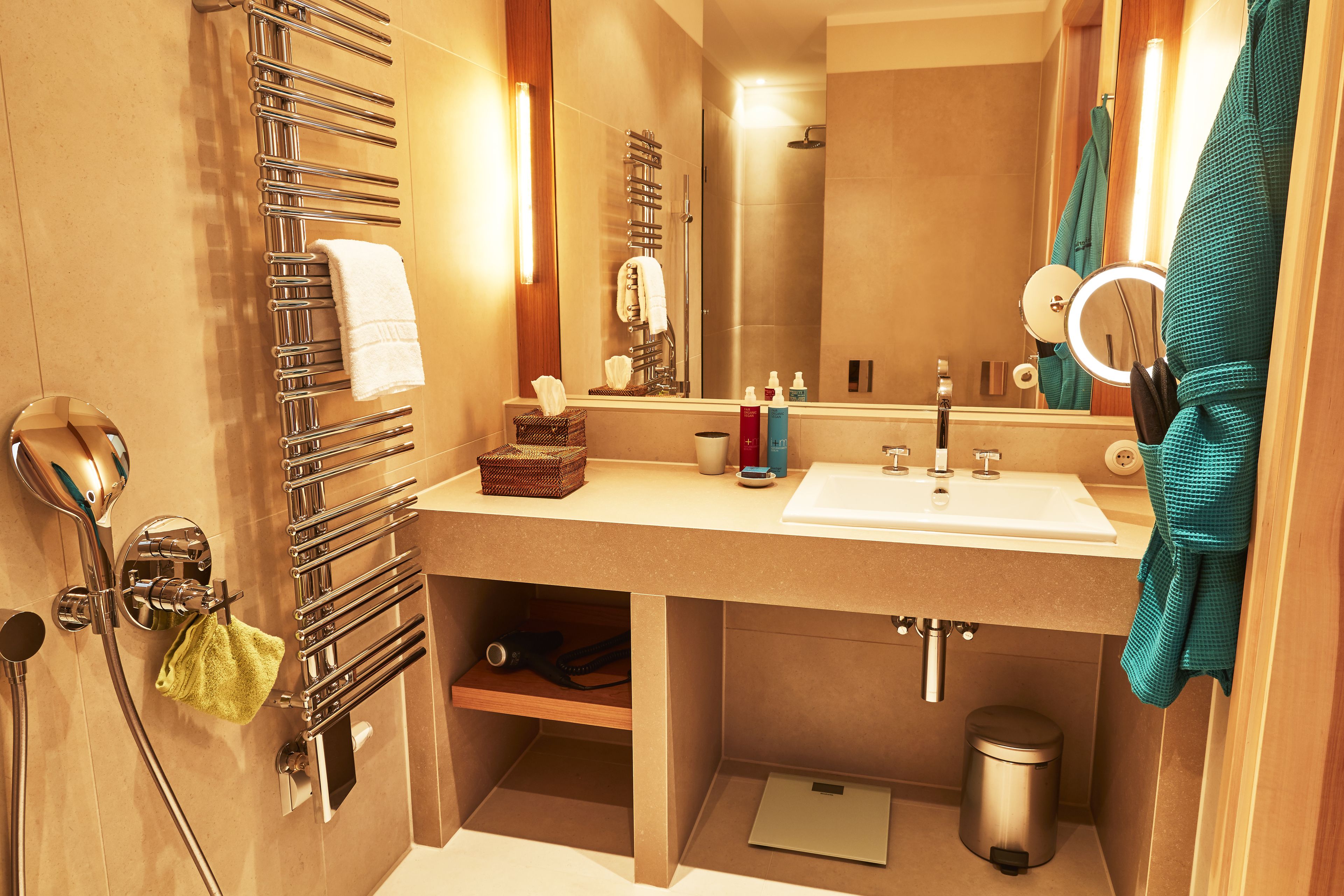 designer toiletries, hair dryer, bathrobes, slippers