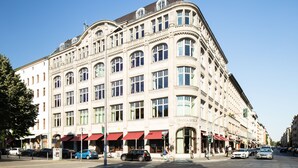 A large, historic building with multiple floors and a classic architectural style. - Orania.Berlin (Berlin)