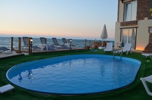 Outdoor pool, pool umbrellas, pool loungers