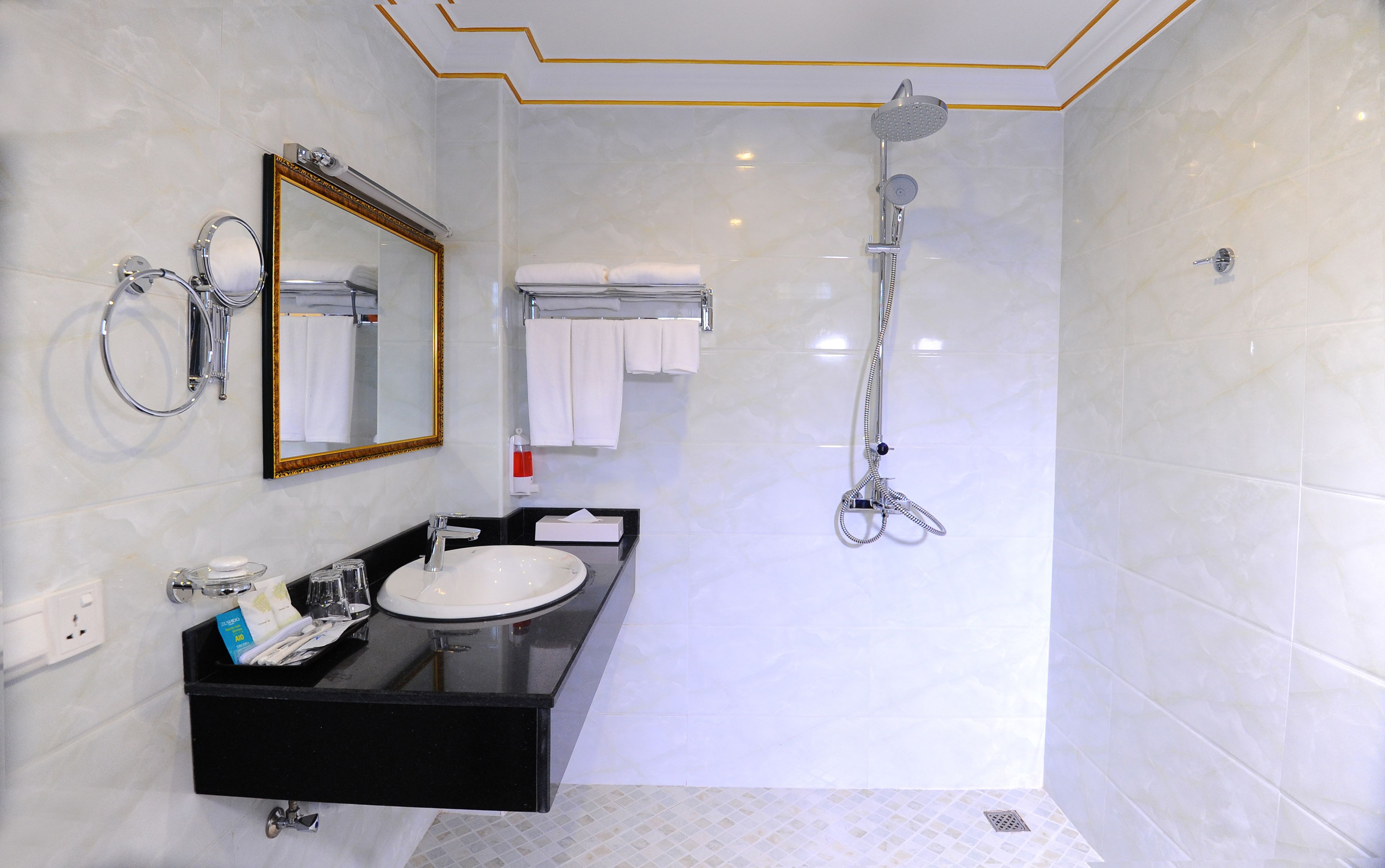 Designer toiletries, hair dryer, bathrobes, slippers