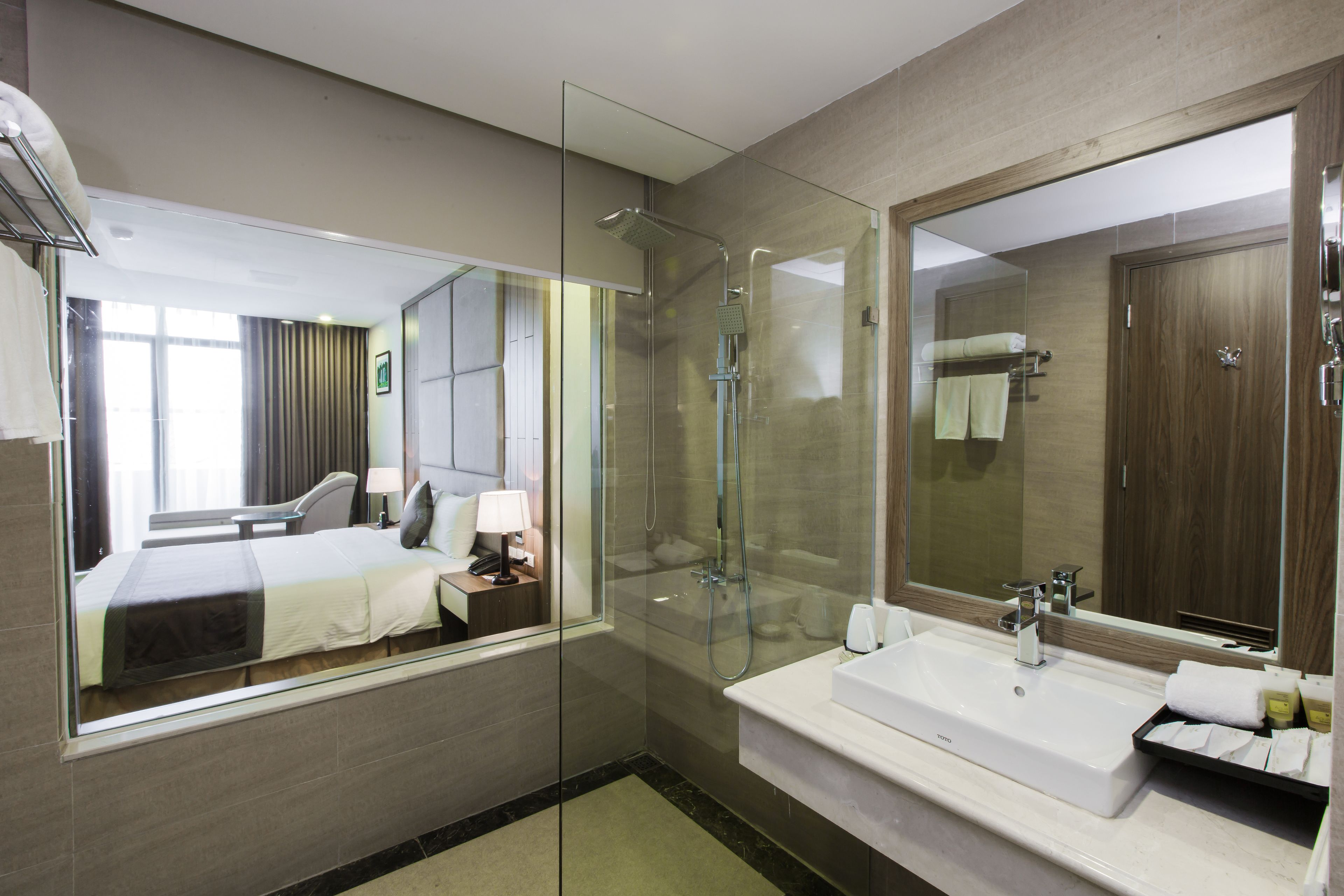 deluxe double room | bathroom | rainfall showerhead, free toiletries, hair dryer, slippers