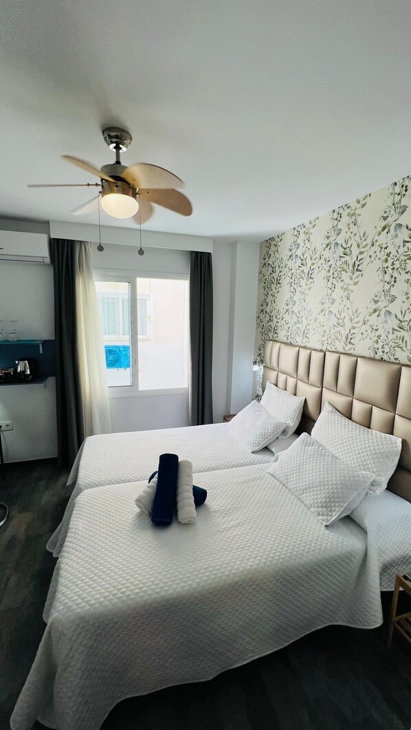 Economy Twin Room | Down duvets, minibar, in-room safe, desk