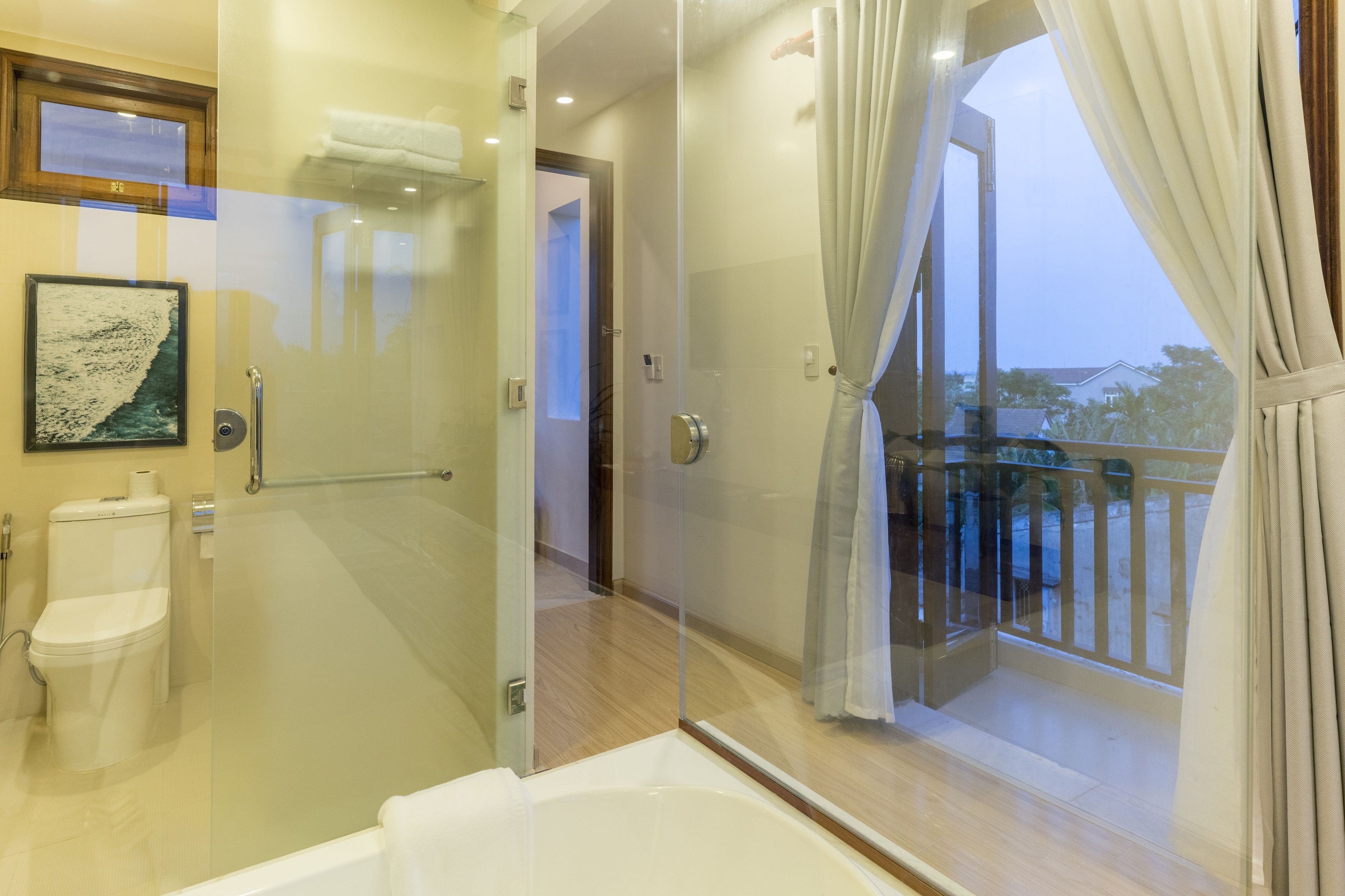 Combined shower/bathtub, designer toiletries, hair dryer, bathrobes