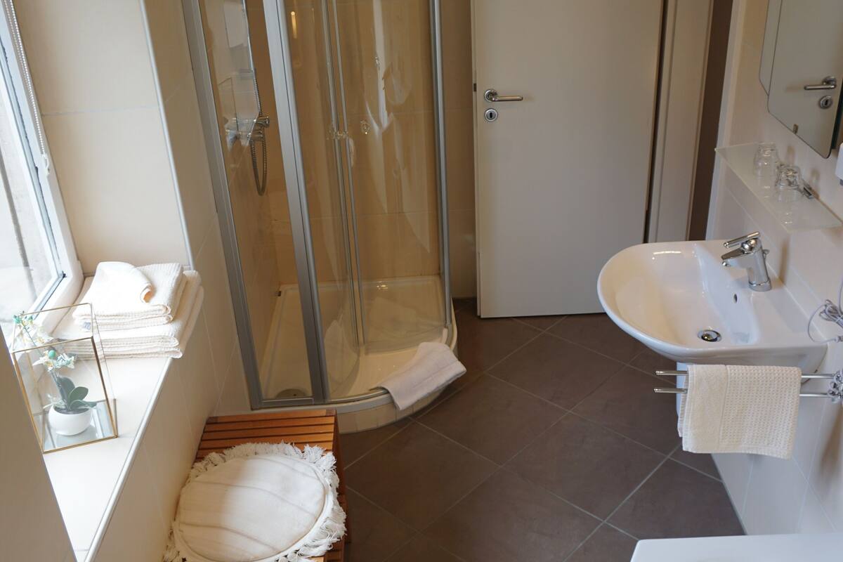 comfort triple room, 1 bedroom, river view | bathroom | shower, free toiletries, towels