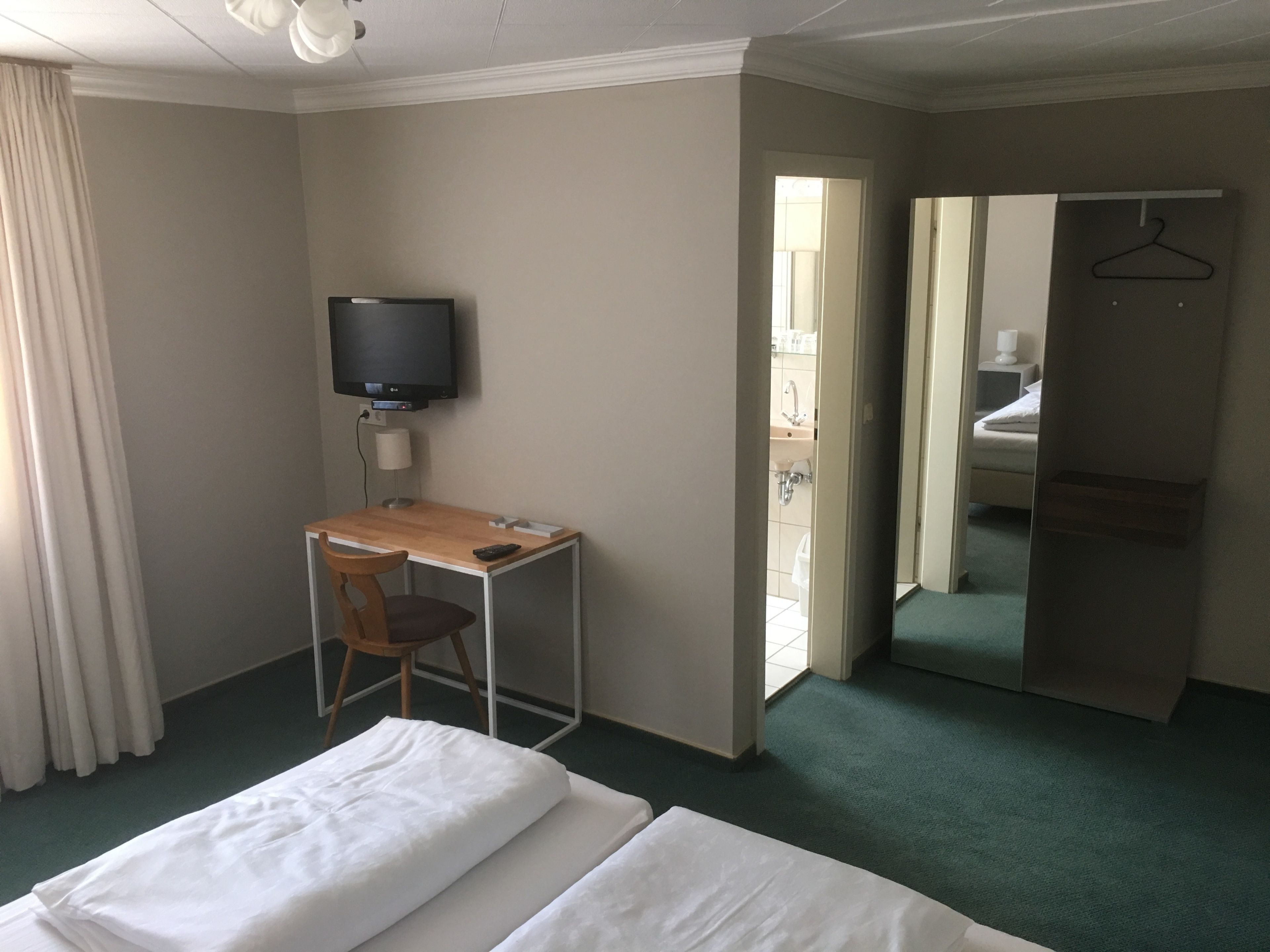 comfort triple room, 1 bedroom, river view | desk, iron/ironing board, cots/infant beds, free wifi