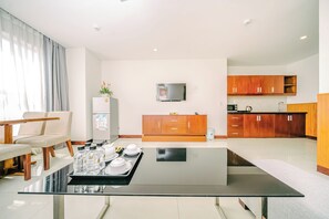 Deluxe Apartment | Living area | 32-inch flat-screen TV with cable channels, TV - Gemma Hotel & Apartment Near Dragon Bridge  (Da Nang)