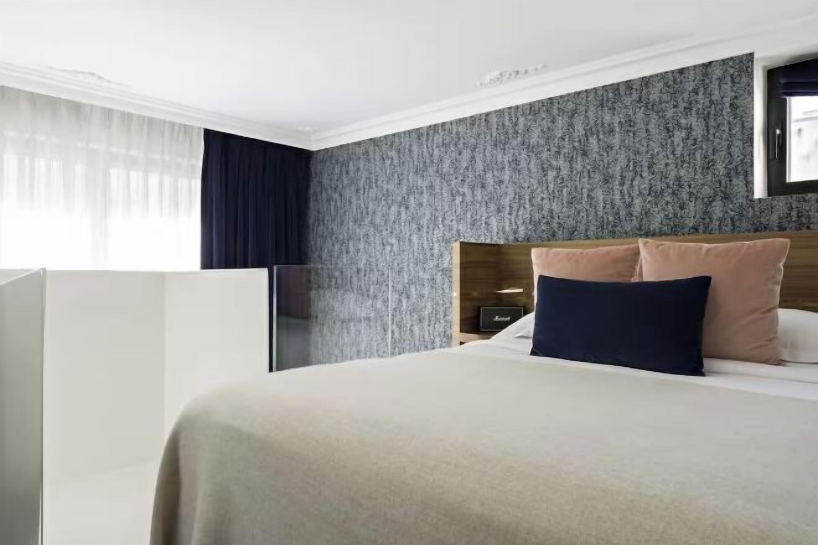 Premium bedding, down comforters, free minibar, in-room safe