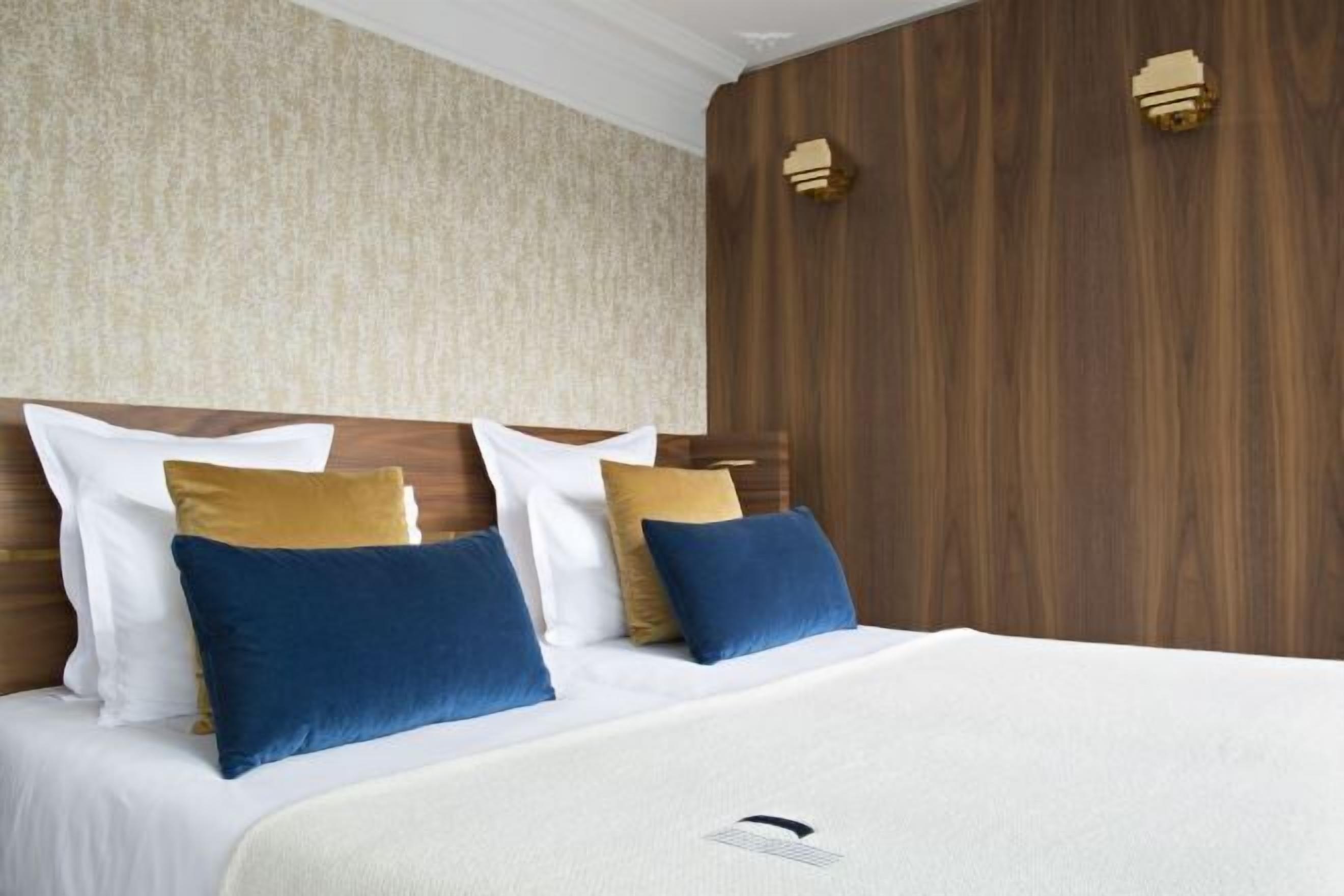 Premium bedding, down comforters, free minibar, in-room safe