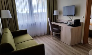 Suite, baignoire | Coin séjour