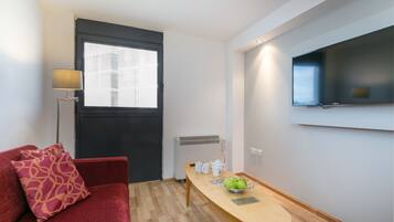 Standard Apartment, 2 Bedrooms | Living area | Flat-screen TV