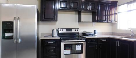 Room, 1 Queen Bed | Private kitchen | Full-size fridge, microwave, oven, stovetop