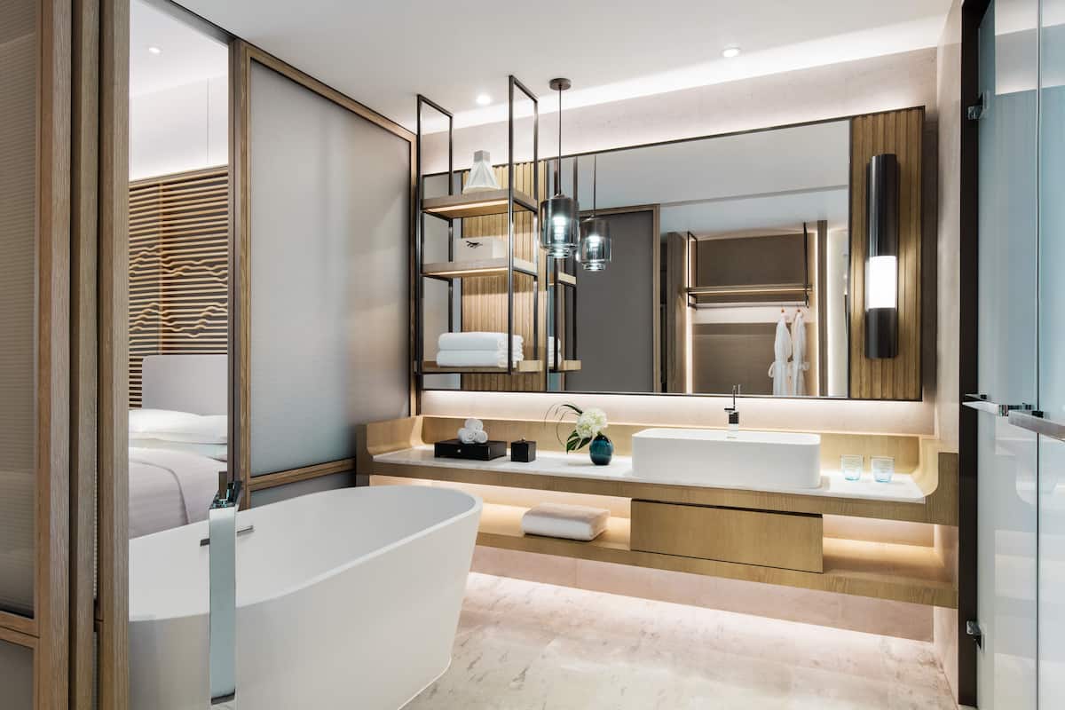 deep-soaking bathtub, rainfall showerhead, free toiletries, hair dryer