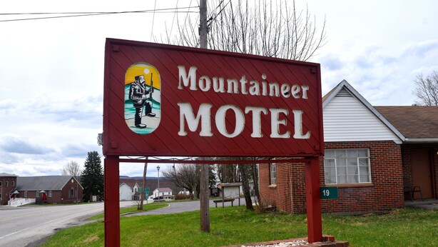 A motel sign with a logo and the name "Mountaineer Motel". - Mountaineer Motel (Mount Storm)