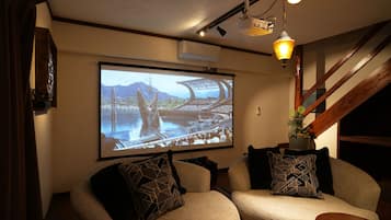 120-inch flat-screen TV with cable channels, video game console, Netflix