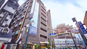 A modern hotel with multiple floors, large windows, and a prominent 'HOTEL K6' sign. - Hotel K6 Osaka Namba  (Osaka)