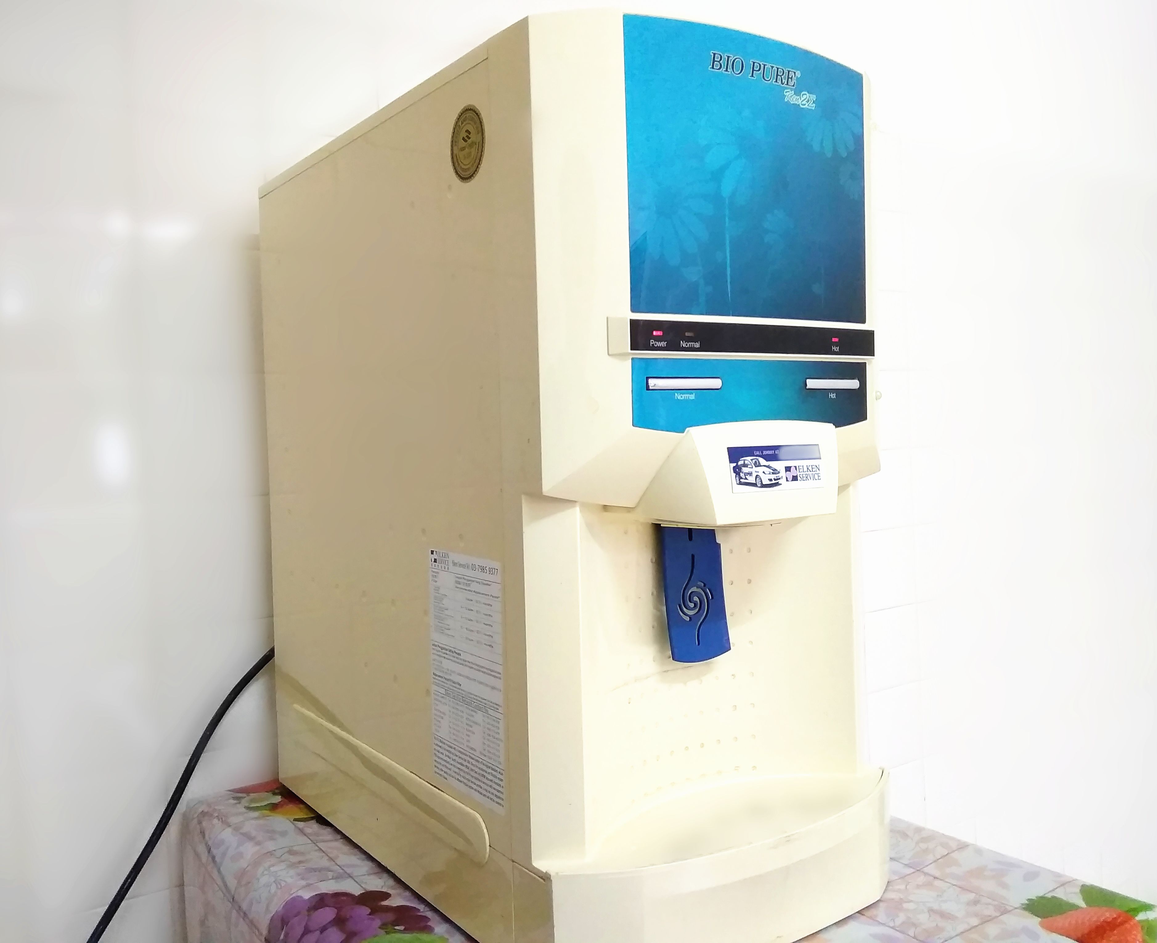 A water dispenser with a blue top labeled "BIO PURE" and a white base.