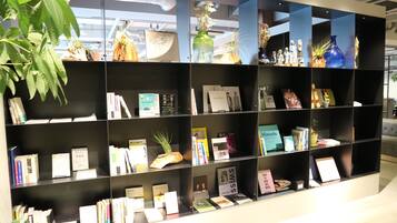 A bookshelf with books and decorative items.