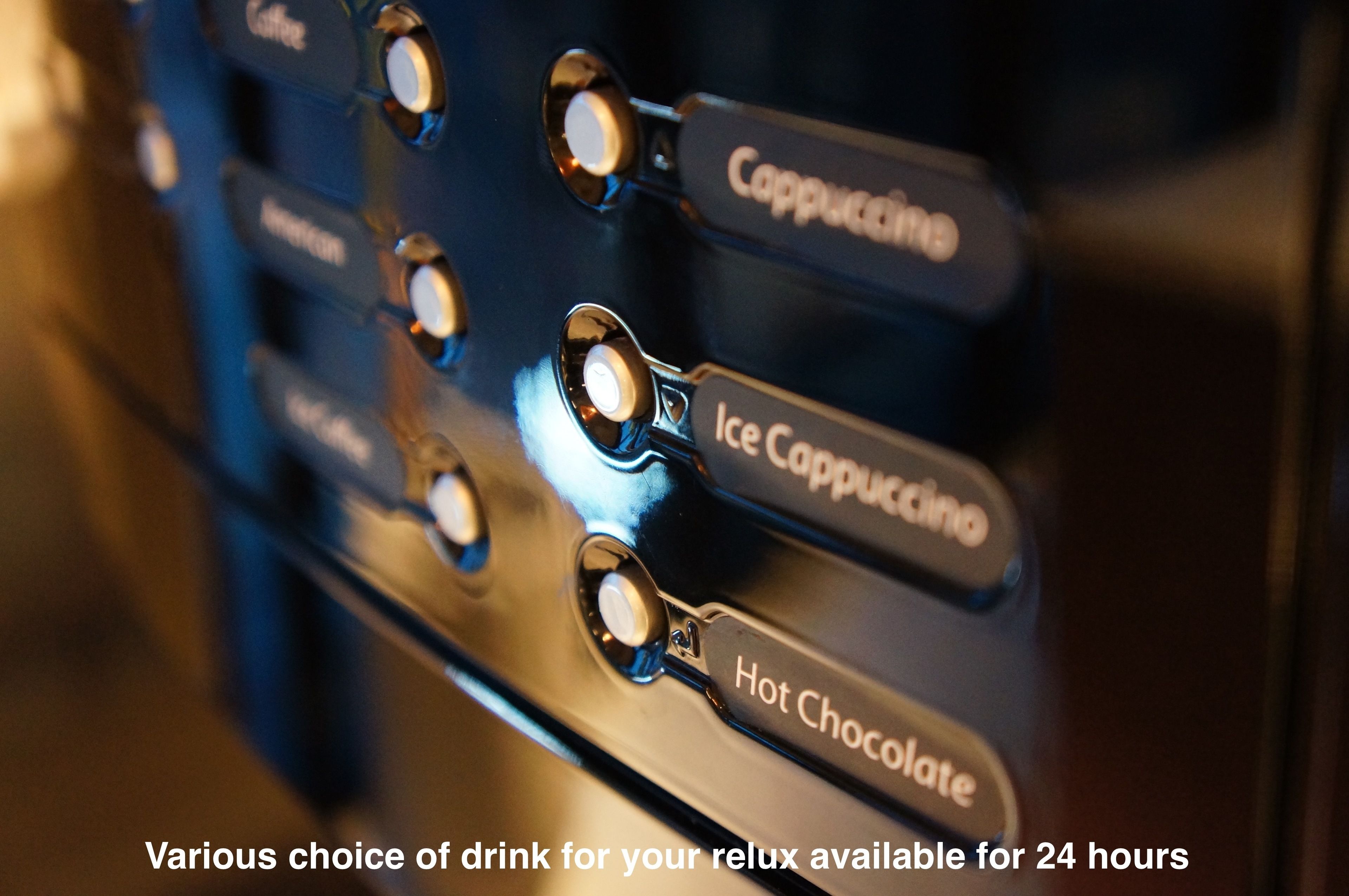 A coffee machine with options for Cappuccino, Ice Cappuccino, and Hot Chocolate.