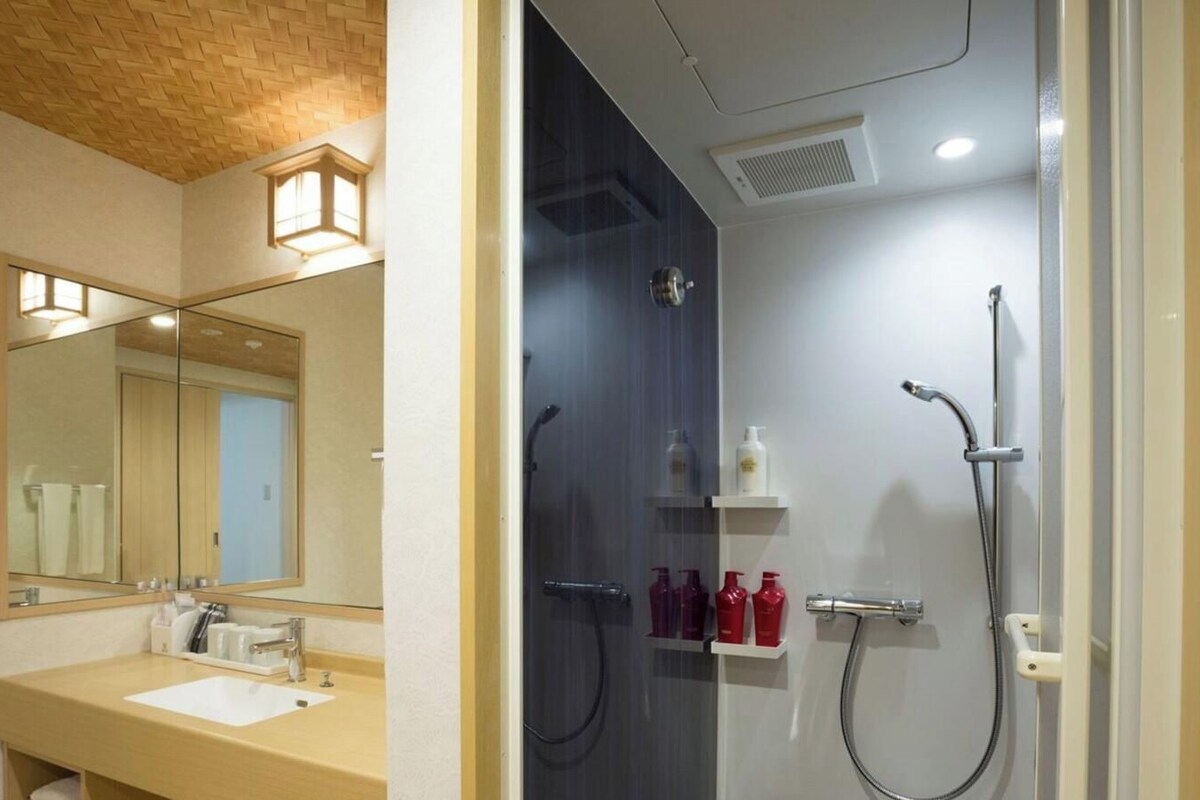 Bathroom | Shower, free toiletries, hair dryer, slippers