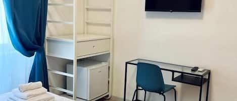 Desk, blackout drapes, soundproofing, iron/ironing board