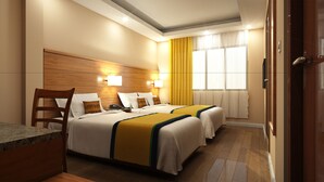Una habitación de hotel con dos camas, un cabecero de madera, un escritorio y una ventana con cortinas.