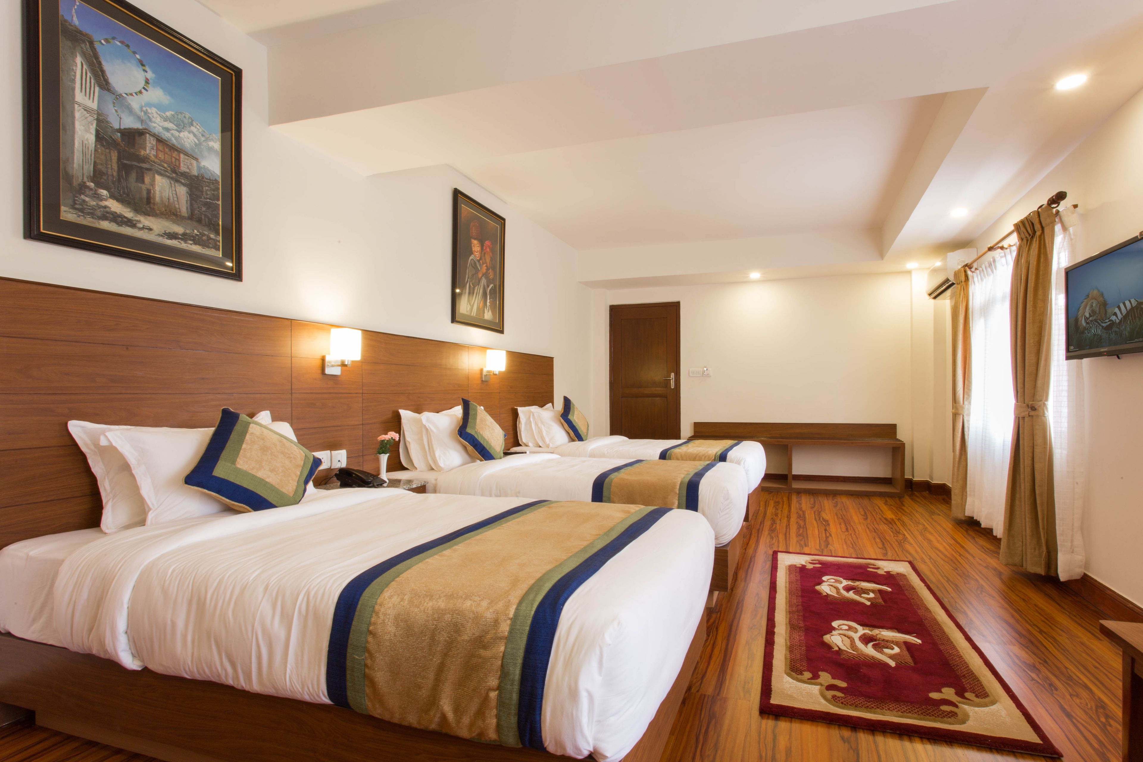 deluxe triple room, 3 single beds, private bathroom, garden view | 1 bedroom, in-room safe, individually decorated, individually furnished