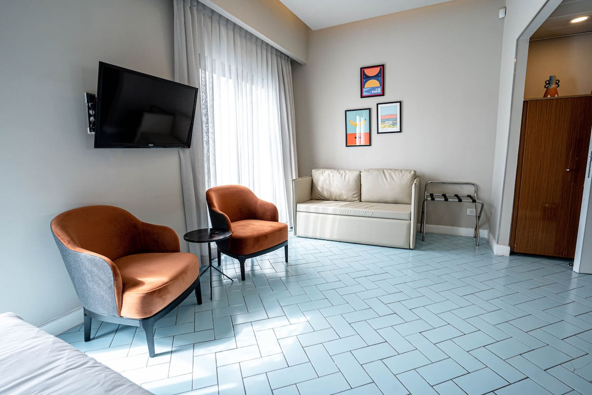 junior suite, balcony | minibar, in-room safe, soundproofing, iron/ironing board