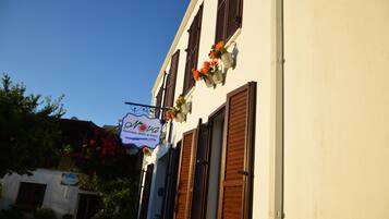 A building with a sign reading "Hotel Nova Boutique Hotel & More."