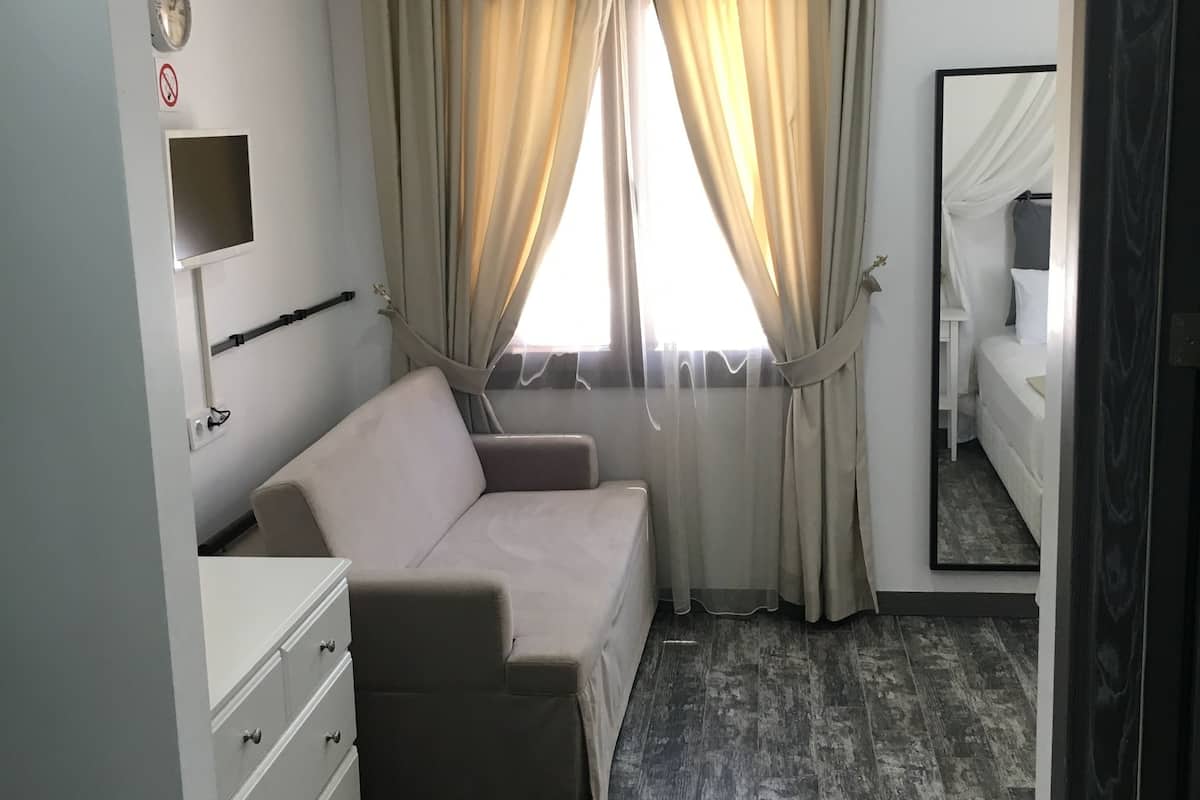 elite quadruple room, 1 bedroom, garden view | free minibar, desk, soundproofing, rollaway beds