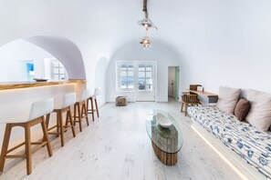 Luxury Villa, 2 Bedrooms, Private Pool, Sea View | Living room | 50-inch flat-screen TV with satellite channels, TV, fireplace - Hyperion Oia Suites (Santorini)