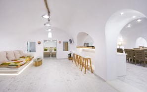 Luxury Villa, 2 Bedrooms, Private Pool, Sea View | Living area | 50-inch flat-screen TV with satellite channels, TV, fireplace - Hyperion Oia Suites (Santorini)