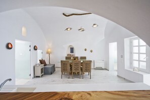 Luxury Villa, 2 Bedrooms, Private Pool, Sea View | Living area | 50-inch flat-screen TV with satellite channels, TV, fireplace - Hyperion Oia Suites (Santorini)