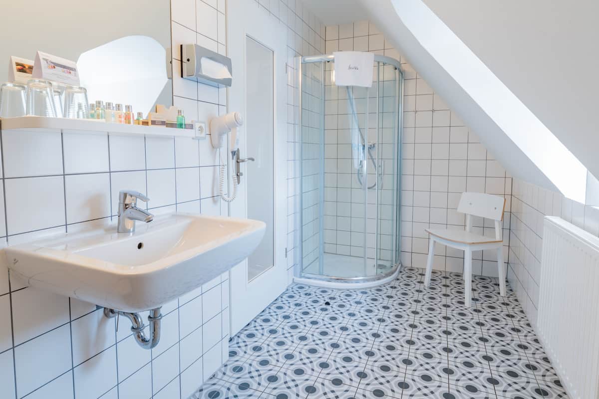 executive double room, city view (keith richards) | bathroom | shower, designer toiletries, hair dryer, bathrobes