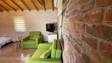 Family Twin Room | Living area | Flat-screen TV