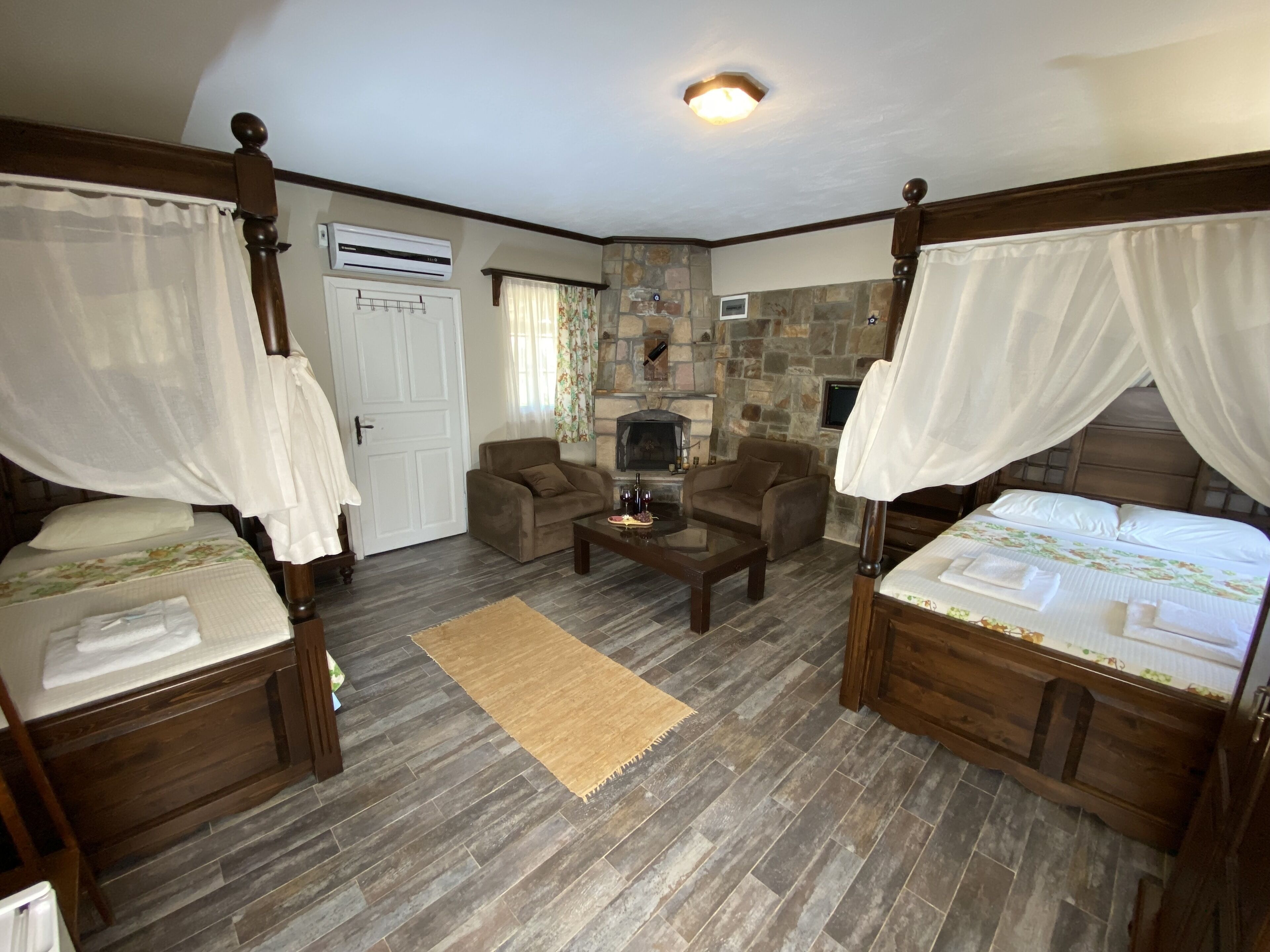 family suite, vineyard view | minibar, in-room safe, iron/ironing board, free wifi