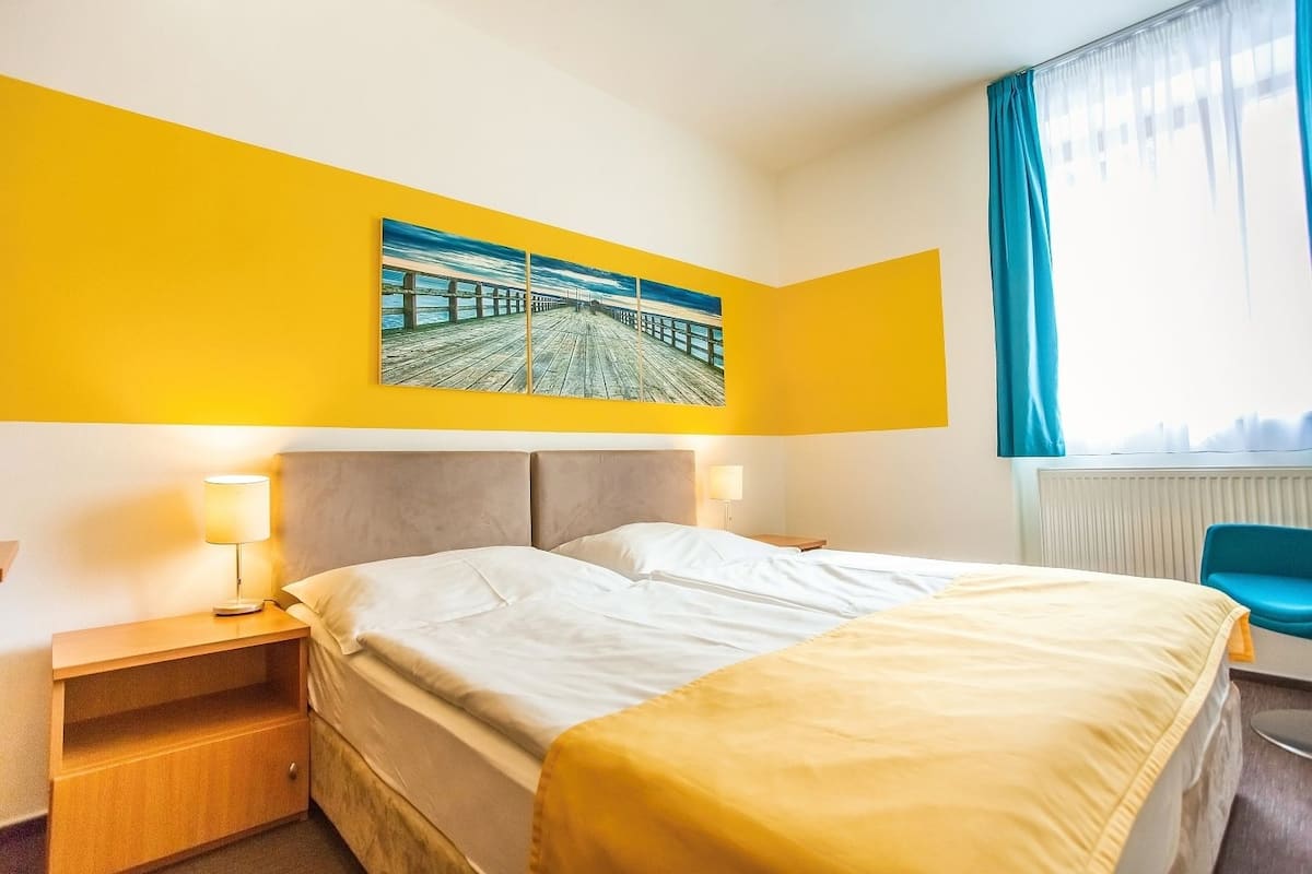 Standard Quadruple Room | Desk, blackout curtains, iron/ironing board, cots/infant beds