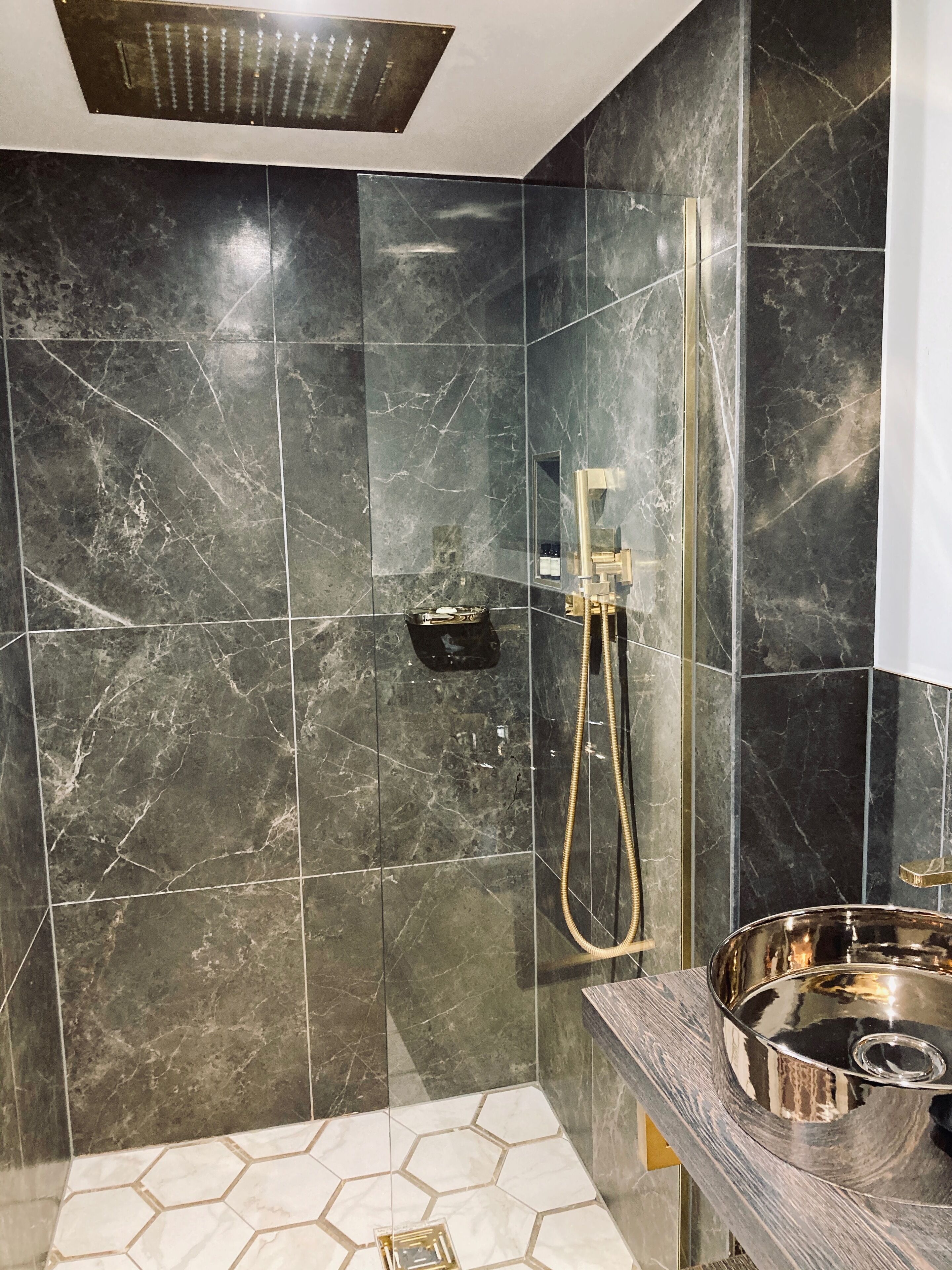 superior super king | bathroom | rainfall showerhead, hair dryer, towels