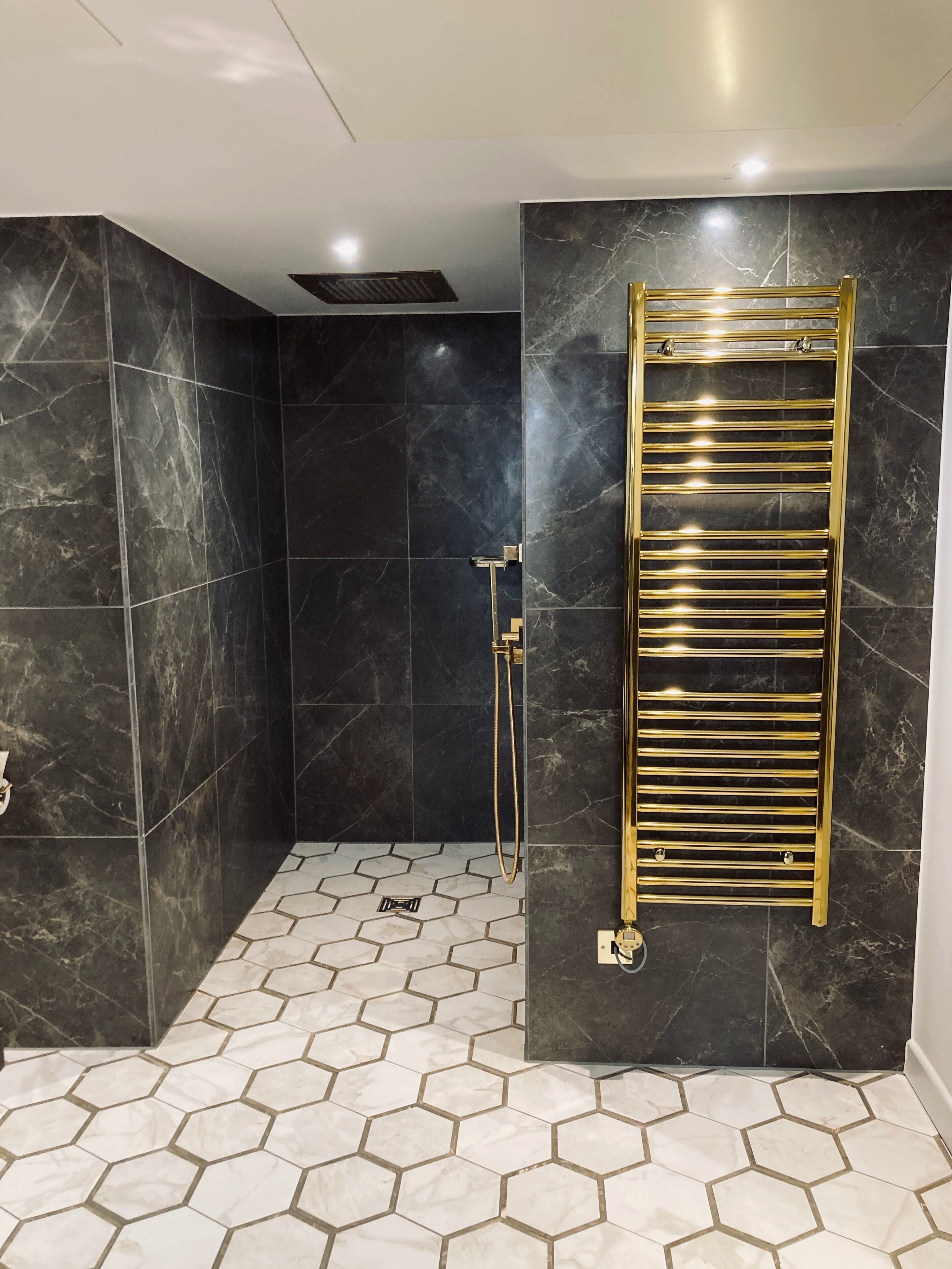 luxury suite, 1 king bed, balcony | bathroom | rainfall showerhead, hair dryer, towels