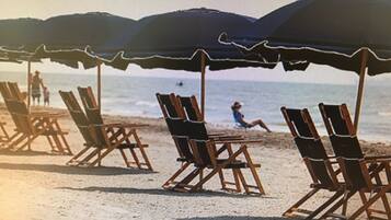 On the beach, sun loungers, beach towels