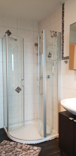 Shower, hair dryer, towels, soap