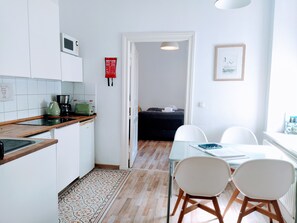 Fridge, microwave, stovetop, coffee/tea maker