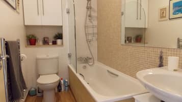 Combined shower/bathtub, hair dryer, towels, soap