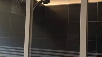 Bathtub, hair dryer, towels, soap