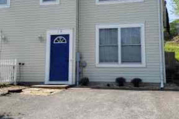 Street view of home with 2 parking spaces.