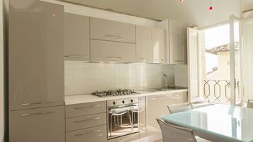 Apartment, 1 Bedroom | Private kitchen | Full-sized fridge, microwave, oven, stovetop