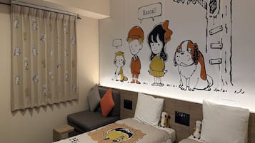 A hotel room with two beds, a large wall mural, a window with curtains, and a small table.