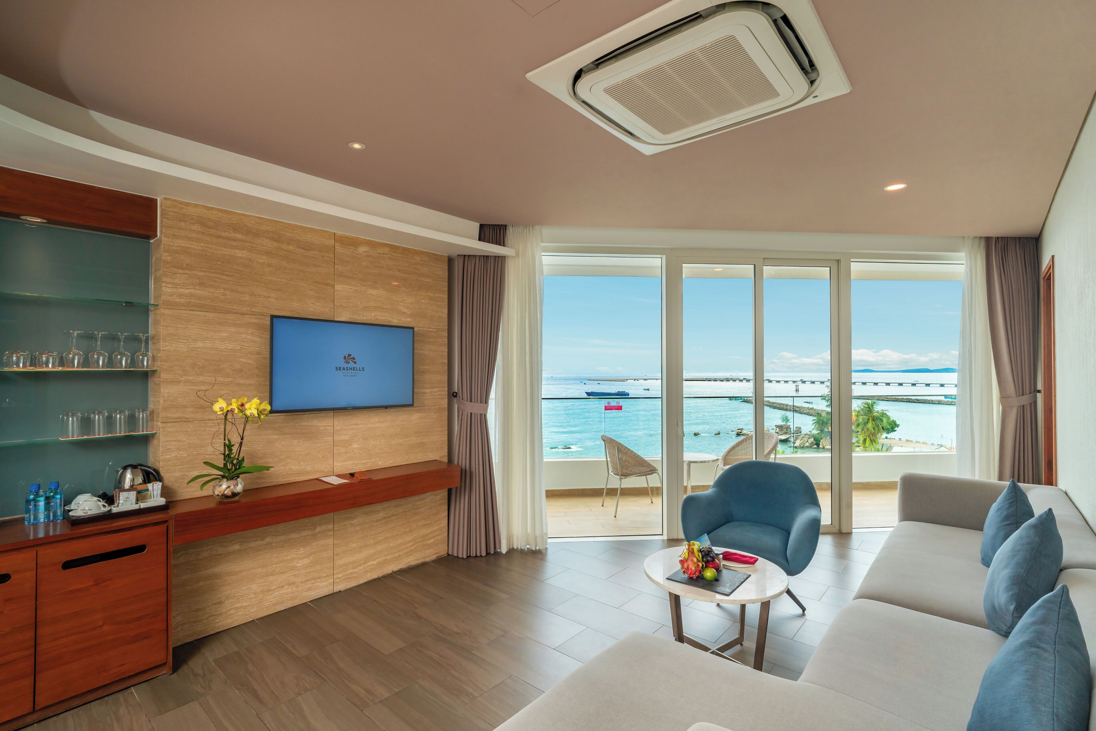 phu quoc suite 2 bedrooms (40-minute body massage for 4) | living room | 32-inch led tv with cable channels, tv
