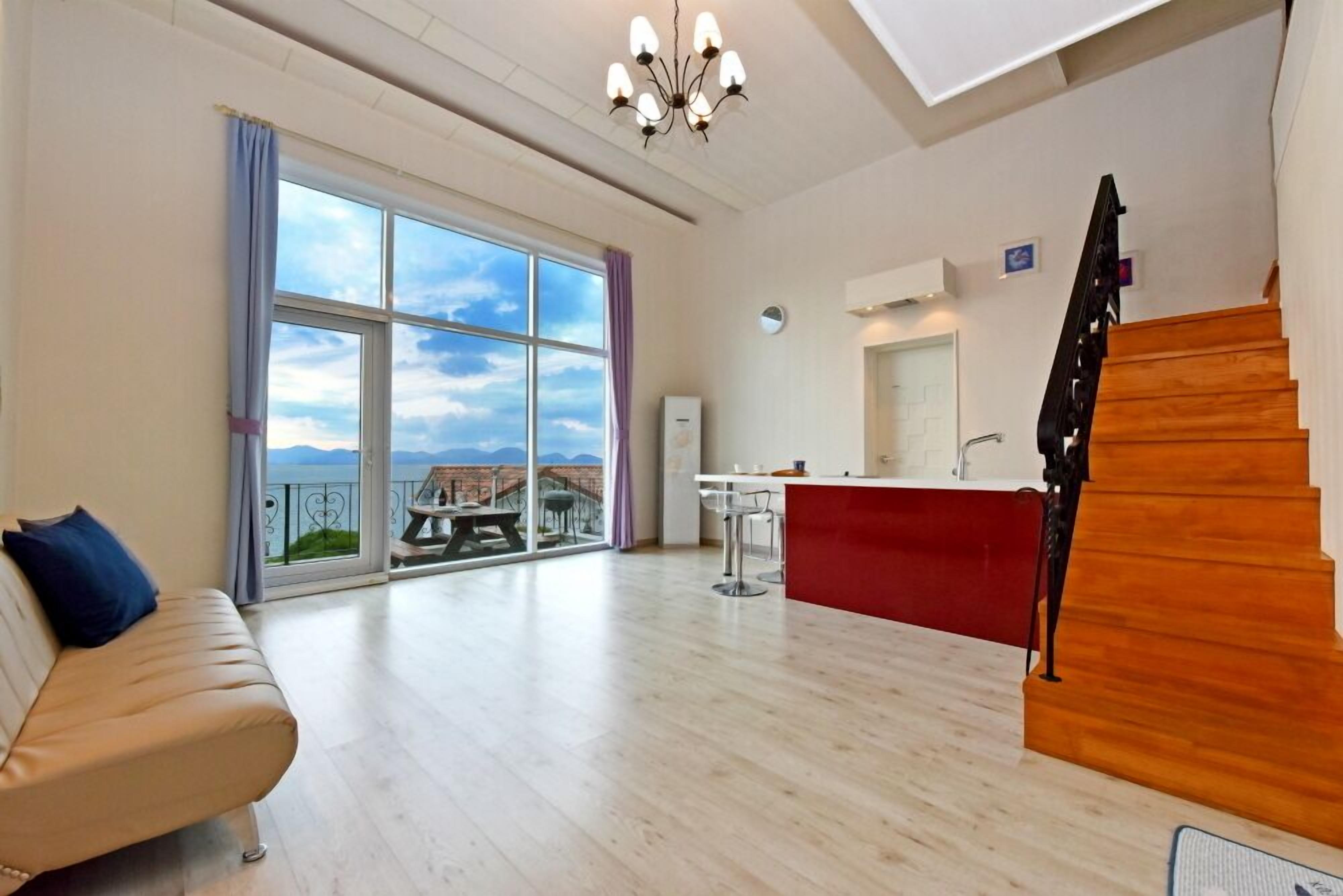 Room, Ocean View (Tropical Blue) | Living area | 42-inch flat-screen TV with satellite channels, TV