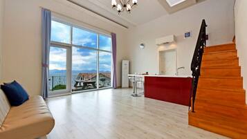 Room, Ocean View (Tropical Blue) | Living area | 42-inch flat-screen TV with satellite channels, TV