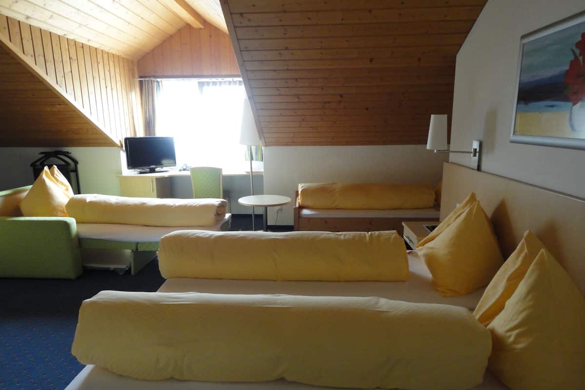 Quadruple Room | Living area | Flat-screen TV
